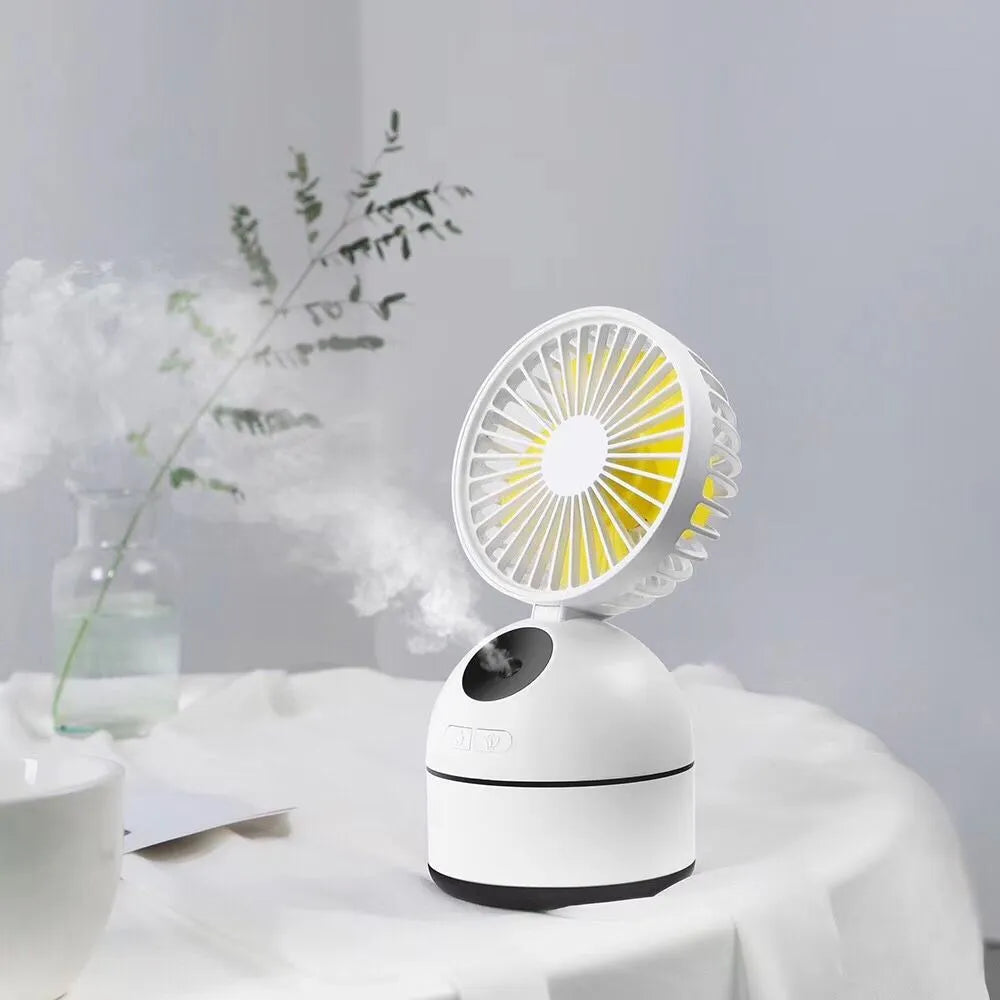 Mini USB fan humidifier in white, side view showing fan blades and mist nozzle