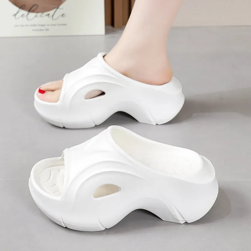 Women's thick-soled EVA beach slippers in rose red colour with round toe design.