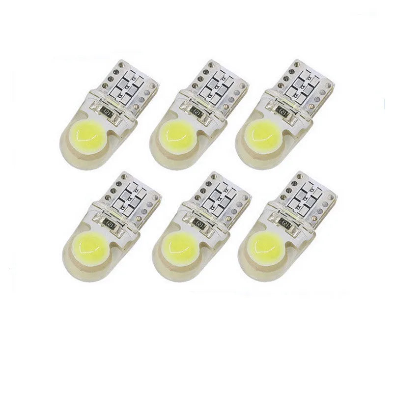 Pack of ten T10 wedge base LED bulbs for cars in seven different colours on a white background