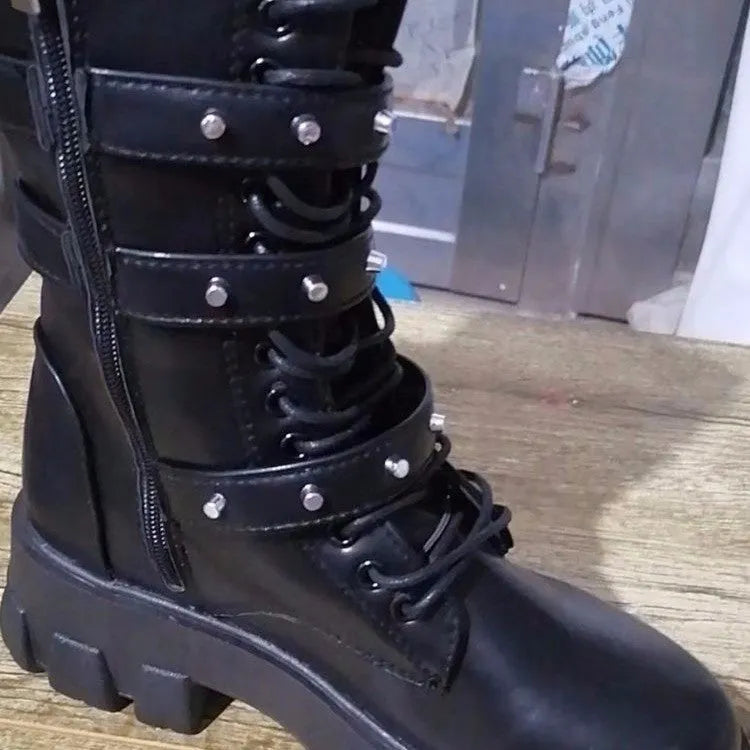 Black women's mid-calf knight boots with metal buckle straps and a side zipper.