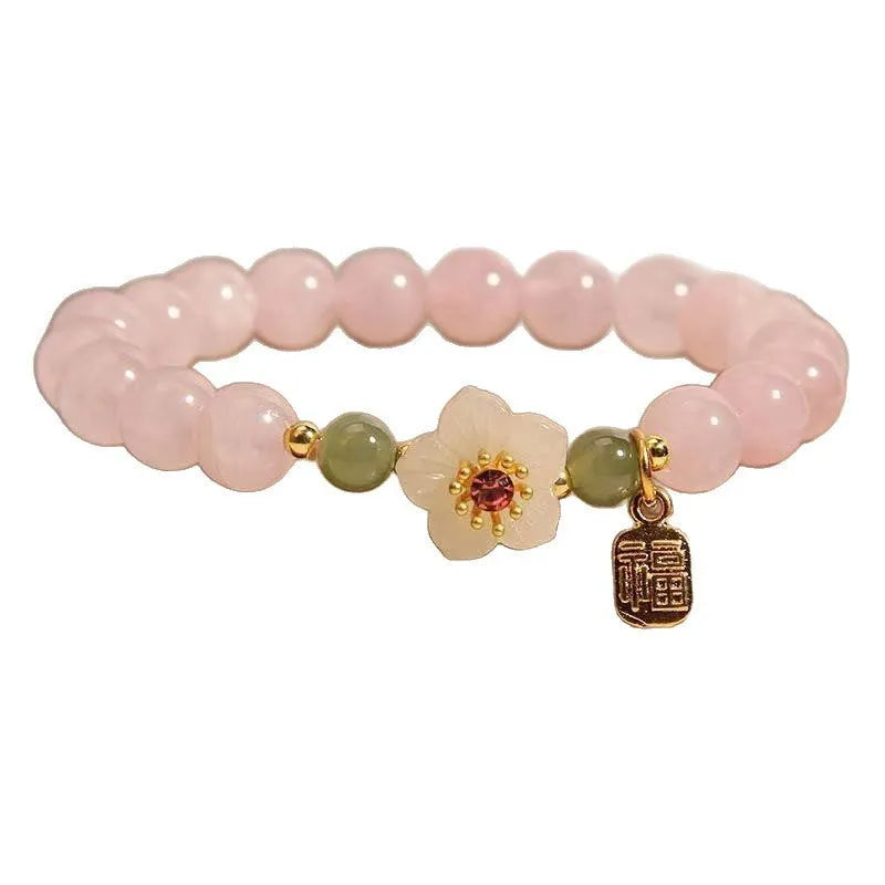 Crystal bracelet with Hetian jade beads, peach blossom charms, and camellia elements in pastoral design