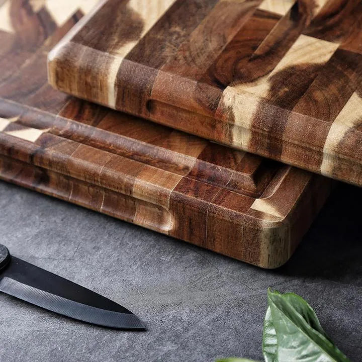 Brown solid wood cutting board with parquet pattern, 3cm thick, on kitchen counter