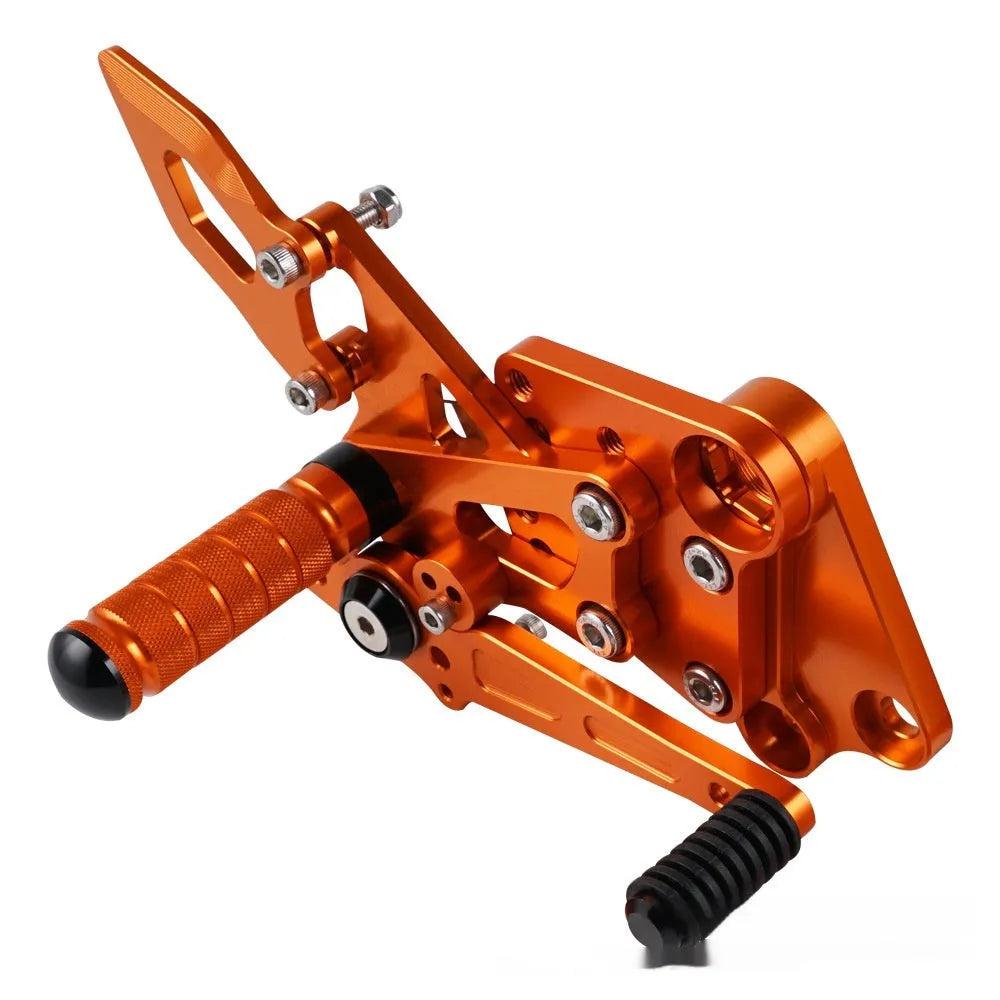 KTM Duke motorcycle pedal support assembly in black and orange for 125 200 250 390 models