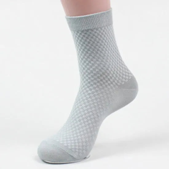 Men's bamboo fibre crew sock with small square pattern in black, navy, grey, and grey-blue colours.