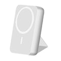 Folding bracket magnetic suction power bank 10000 MA in black plastic shell with phone attached showing stand mode