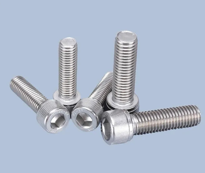 Stainless steel phono cartridge mounting screw set with allen bolts, nuts, washers, and two allen keys on a grey background