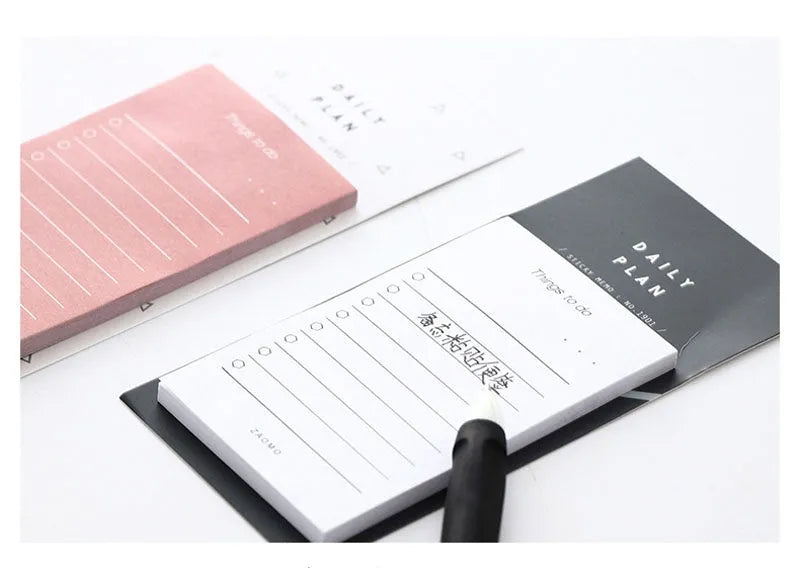 A6 notebook planner with pink or red cover, 50 sheets of 80g writing paper, 10cm by 6cm interior
