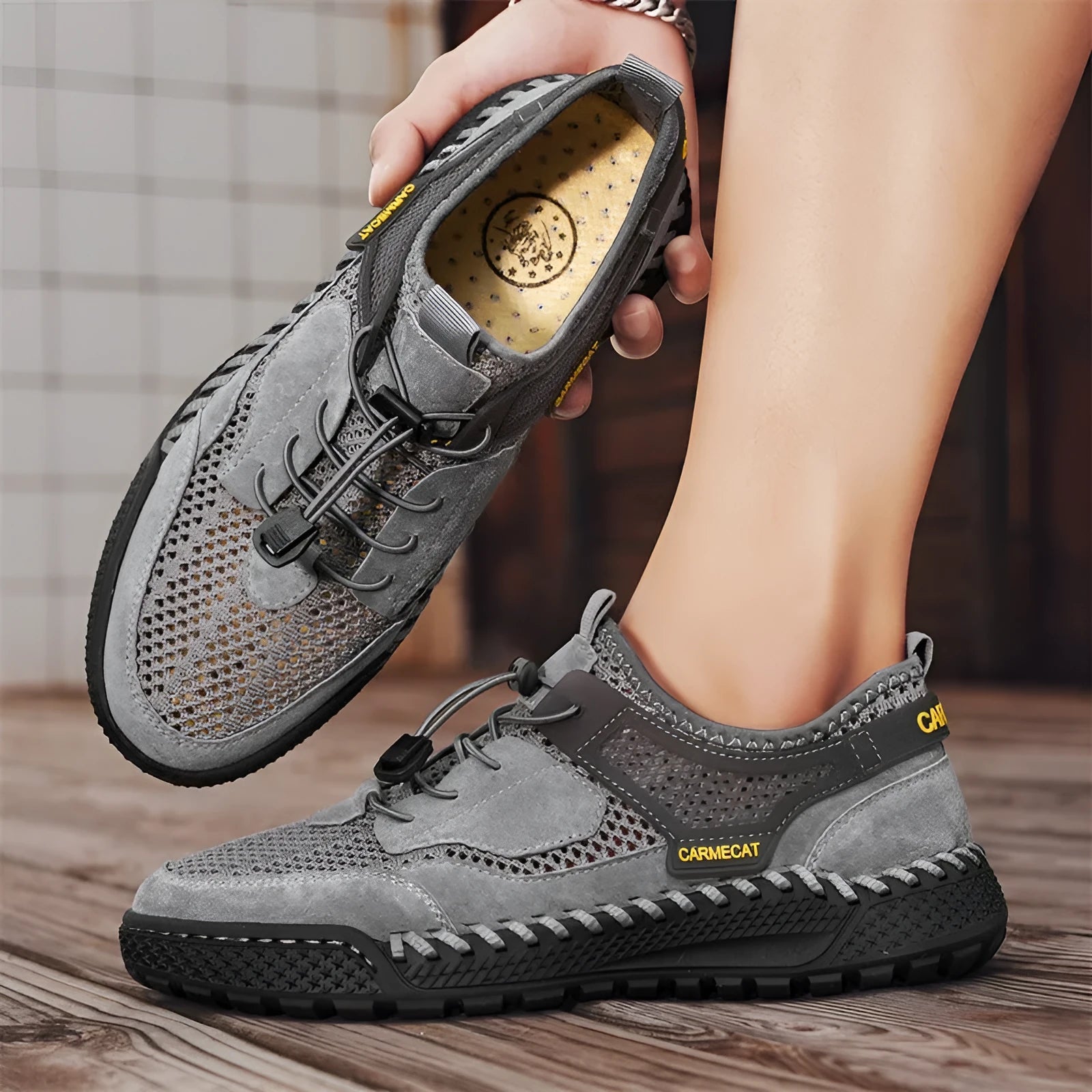 Men's brown suede low-top casual tennis shoes with elastic band and hand-stitched rubber sole.