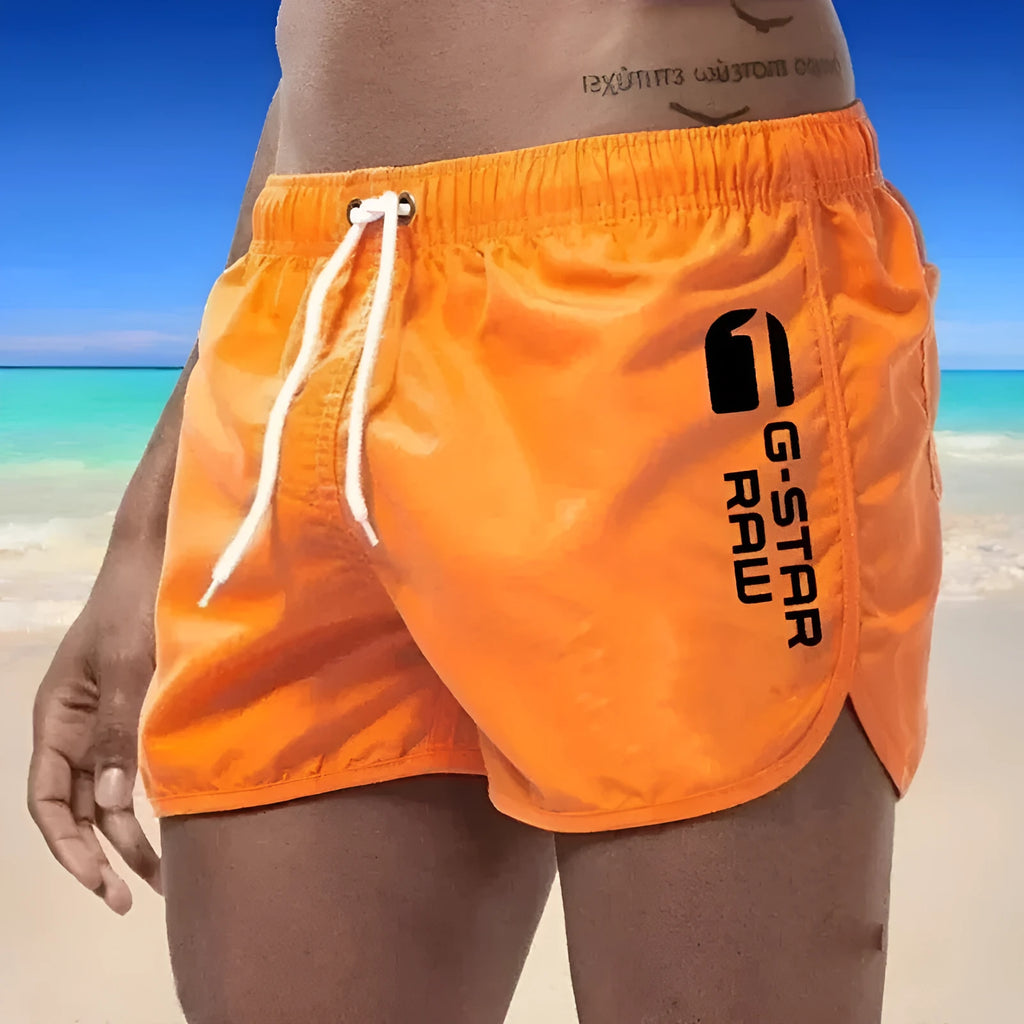 Man wearing lightweight polyester hemp-blended sports shorts in a vibrant colour with a micro-elastic waistband.