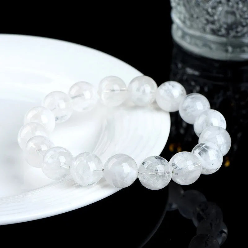 Crystal bracelet with natural blizzard pattern showing Ruyi and Xiangyun elements on round beads