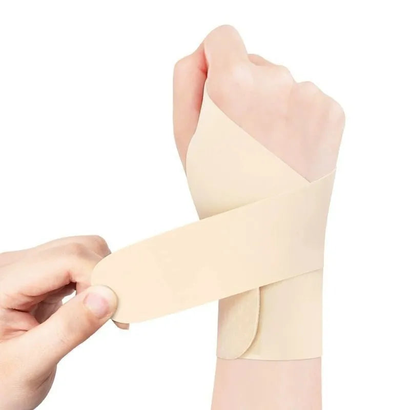 Adjustable black athletic wristguard shown on a wrist, suitable for sports like tennis and badminton.