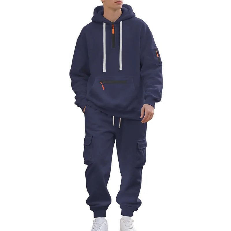 Men's loose two-piece hoodie set with fleece-lined hood, zip front, and multi-pocket top in dark gray.