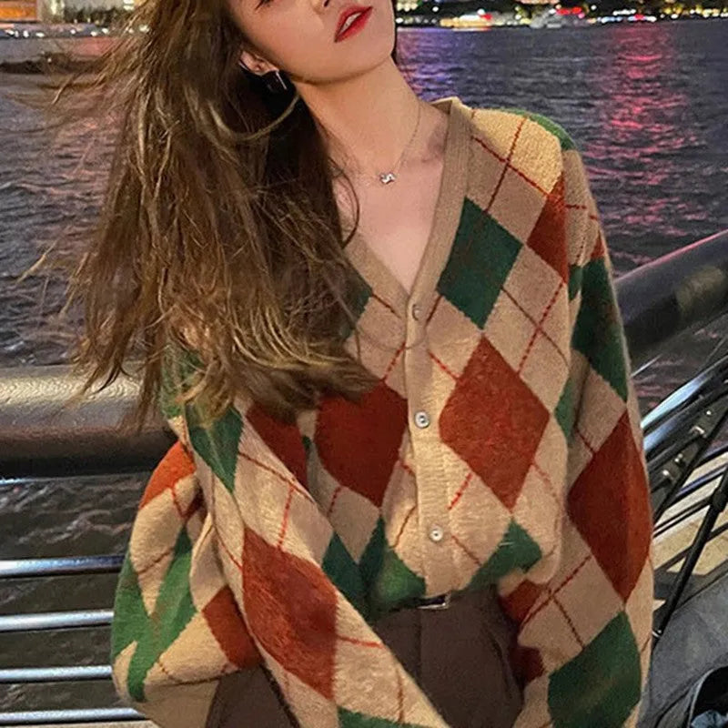 A casual knitted acrylic cardigan coat in a macaron colour, shown in a regular fit with regular sleeves.
