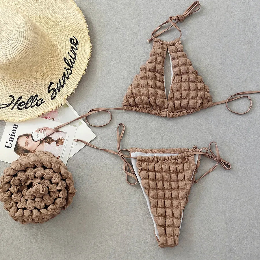 Brown seersucker three-piece bikini swimsuit with lace-up top, matching pants, and skirt for women