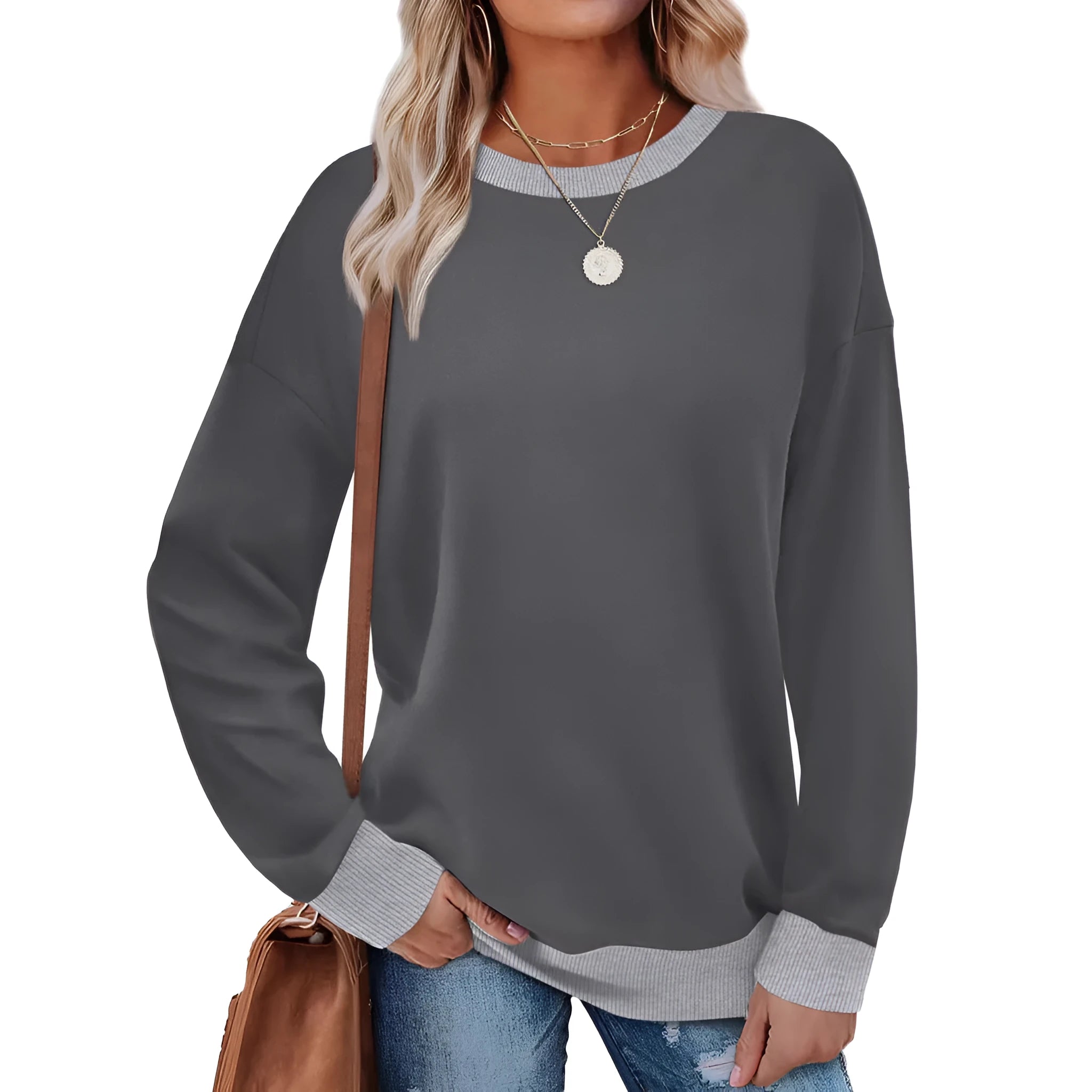 Woman wearing a loose-fitting, long-sleeved striped top with a round neckline in a choice of seven colours.