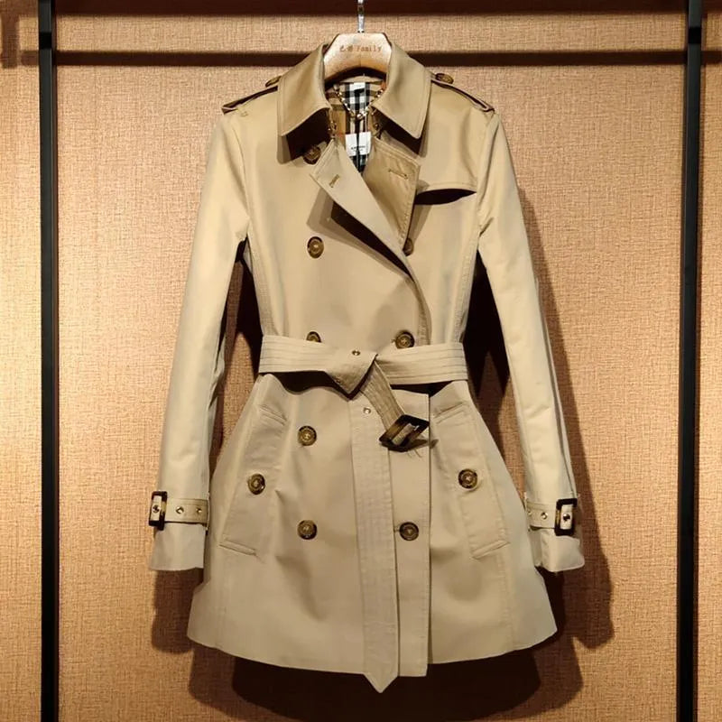 Khaki women's double-breasted polyester trench coat with flight sleeves on a hanger