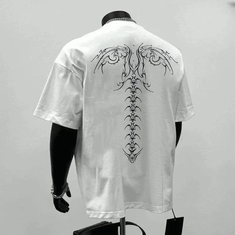 Man wearing a black loose-fit pure cotton short sleeve t-shirt with a printed design.
