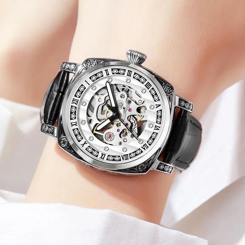 Mechanical wristwatch with luminous hands and a leather strap, shown in a choice of colours.