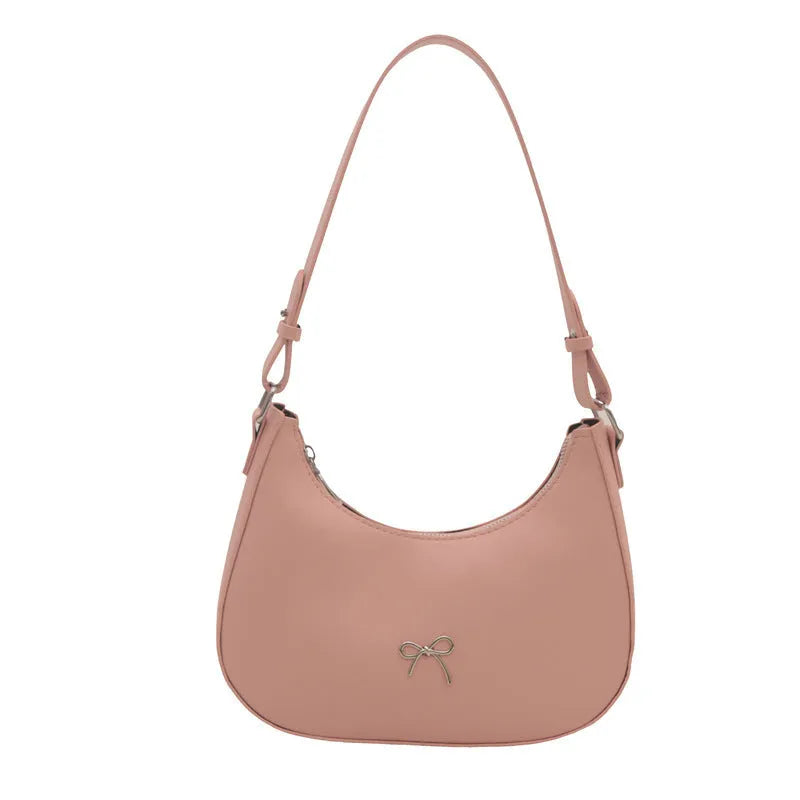 Small dumpling-shaped PU leather women's shoulder bag in khaki with a single strap and zip closure.