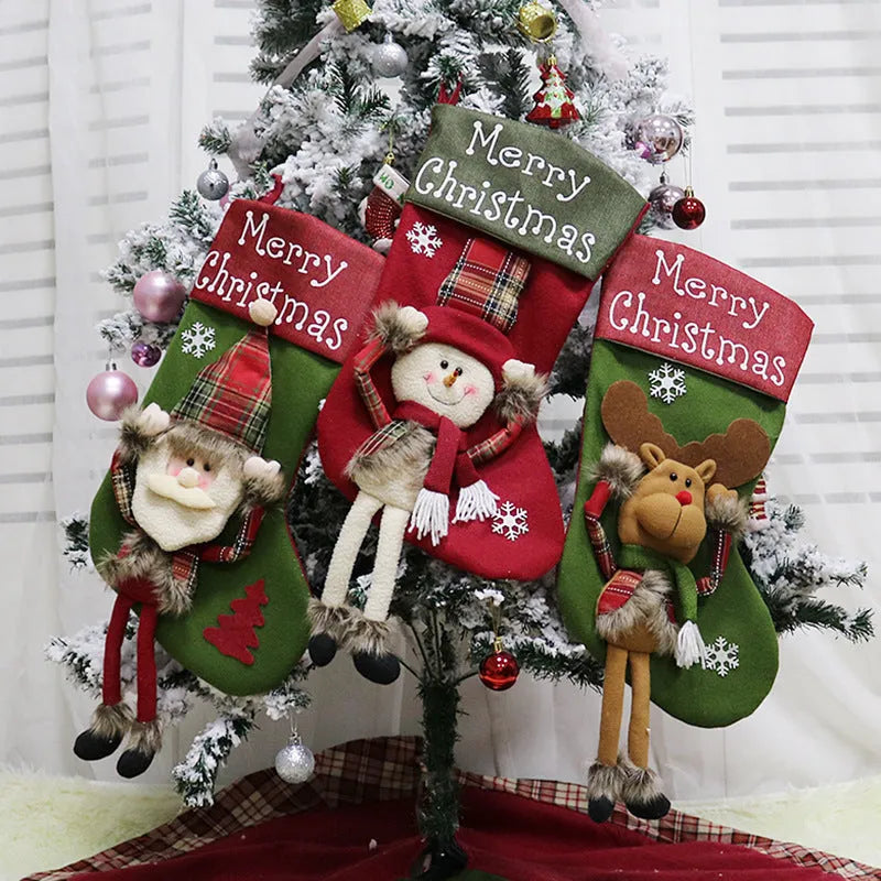 Three large red Christmas stockings with Santa, Snowman and Reindeer 3D applique designs