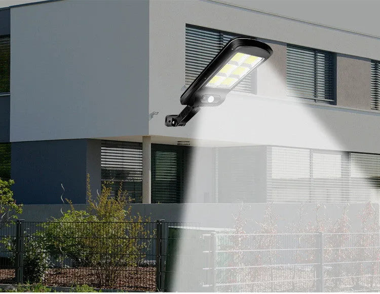 Black solar motion sensor outdoor light with IP65 waterproof rating for garden and pathway illumination
