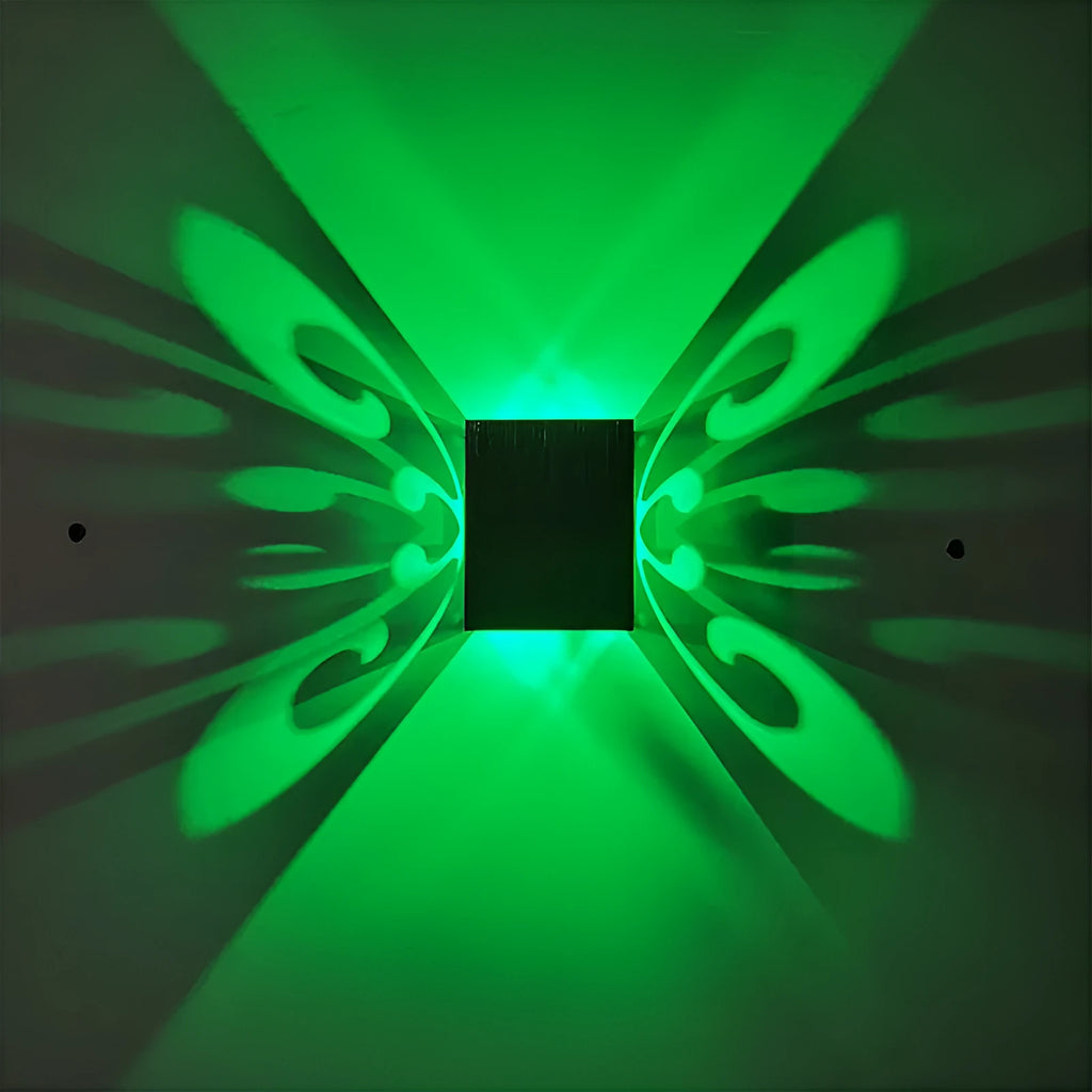 Modern aluminium butterfly-shaped LED wall lamp with remote control for changing light colours.