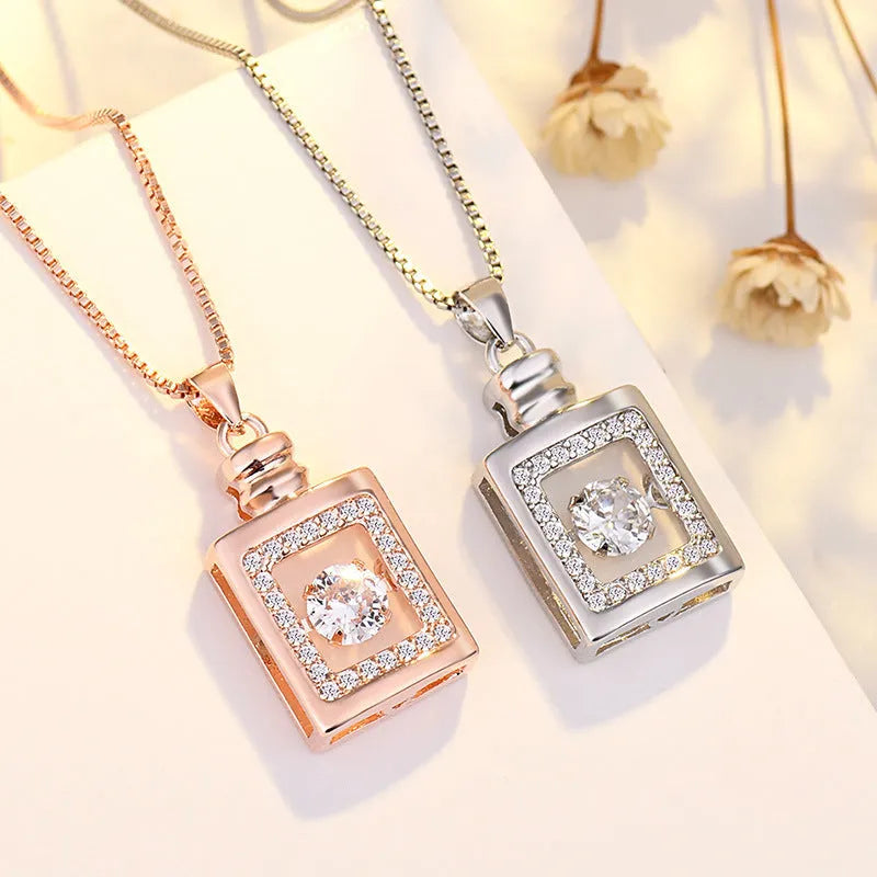 Women's sterling silver love heart necklace with crown and bow details on pendant