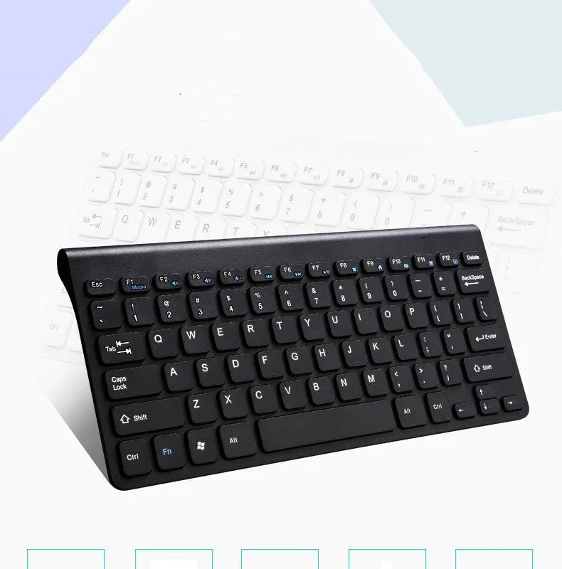 Black and white wireless keyboard and mouse set on a desk.