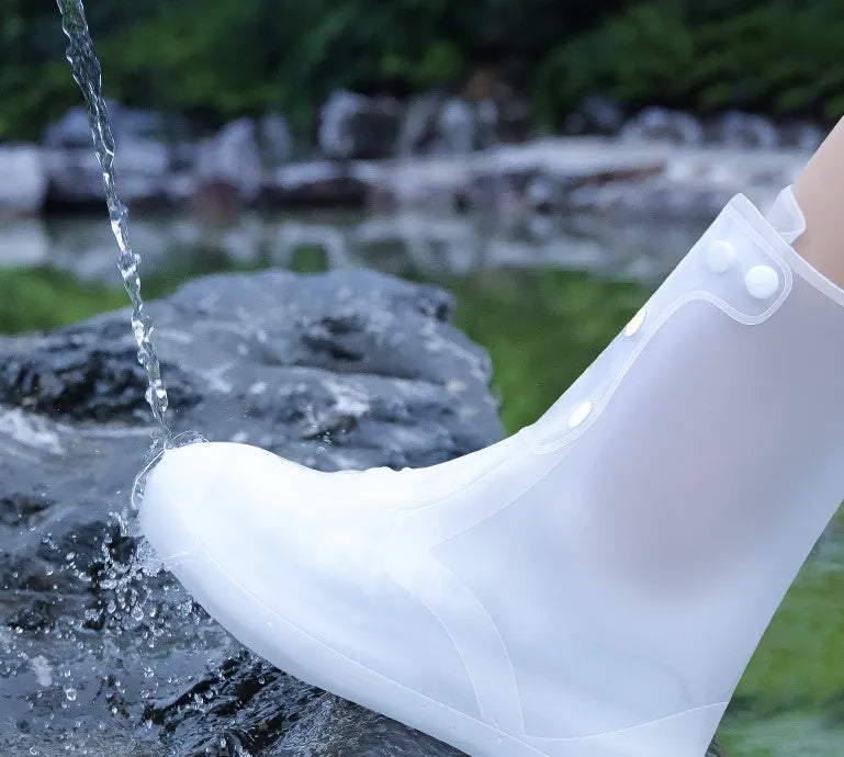 White reusable PVC high-top waterproof shoe cover for women with anti-skid sole.