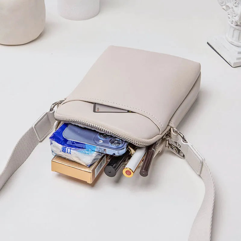 Solid colour PU leather mobile phone crossbody bag measuring 14.5x5.5x19cm
