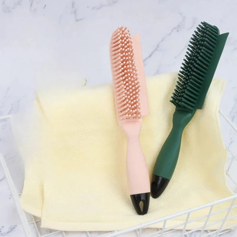 Green and pink dog brush with rubber bristles and pet hair remover function