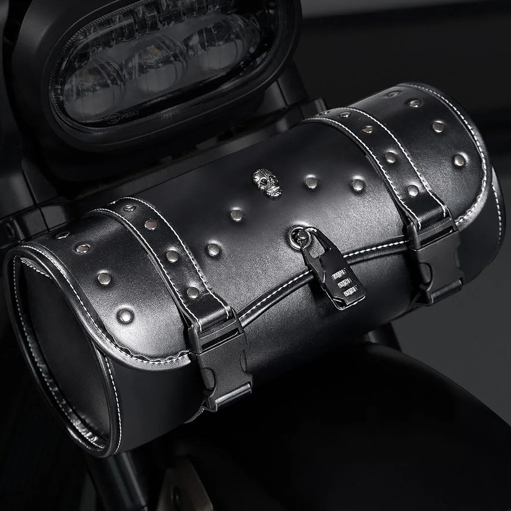 Black PU motorcycle pannier bag with punk retro styling mounted on a bike.