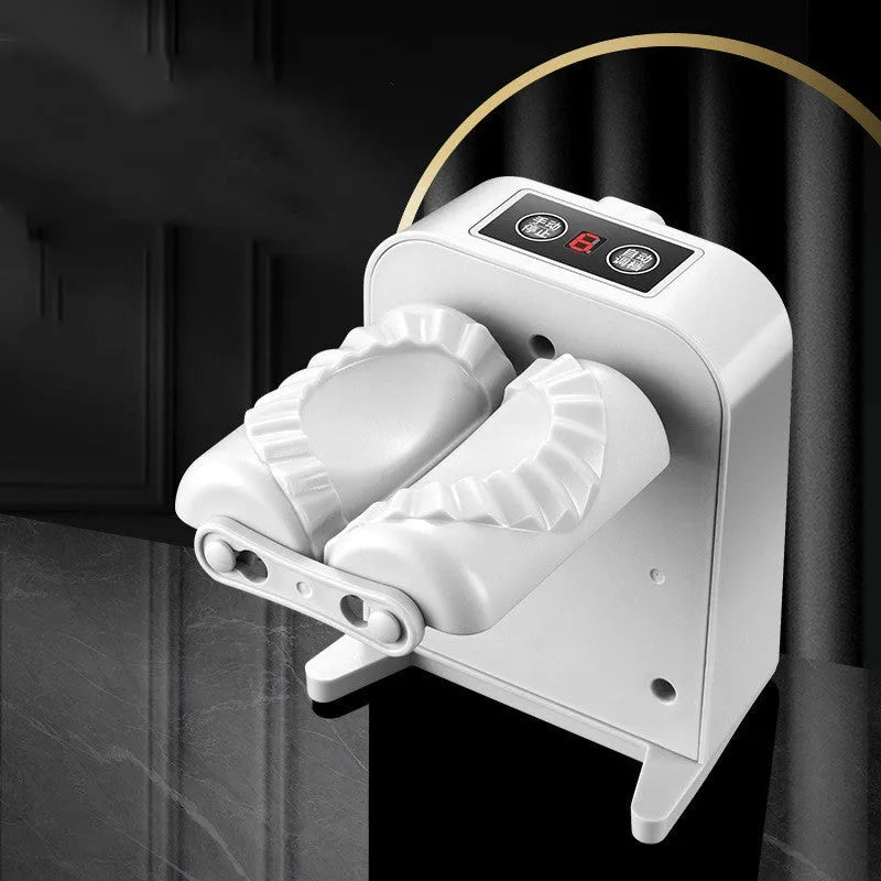 White electric automatic dumpling maker machine with accessories on a kitchen counter.