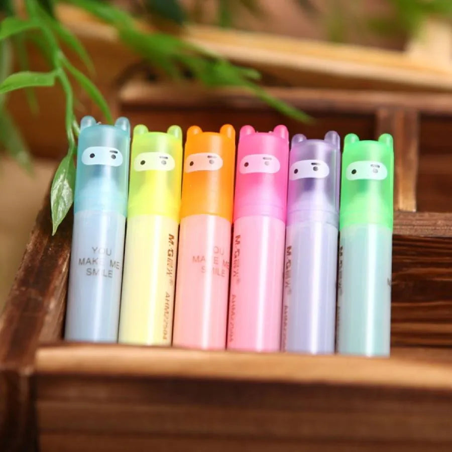 Set of six highlighter pens in different colours showing oblique tip design.
