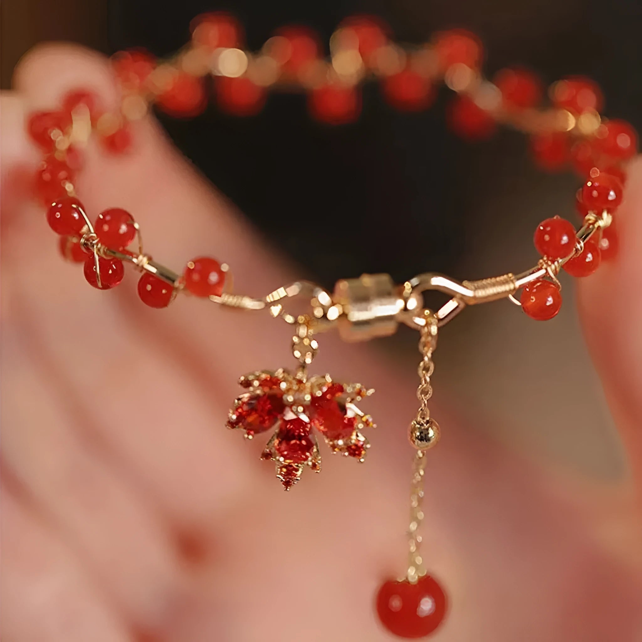 Red Chinese style magnetic bracelet with ginkgo leaf design and electroplated finish
