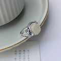 Adjustable copper vintage ring with white chalcedony gemstone and U-shaped band