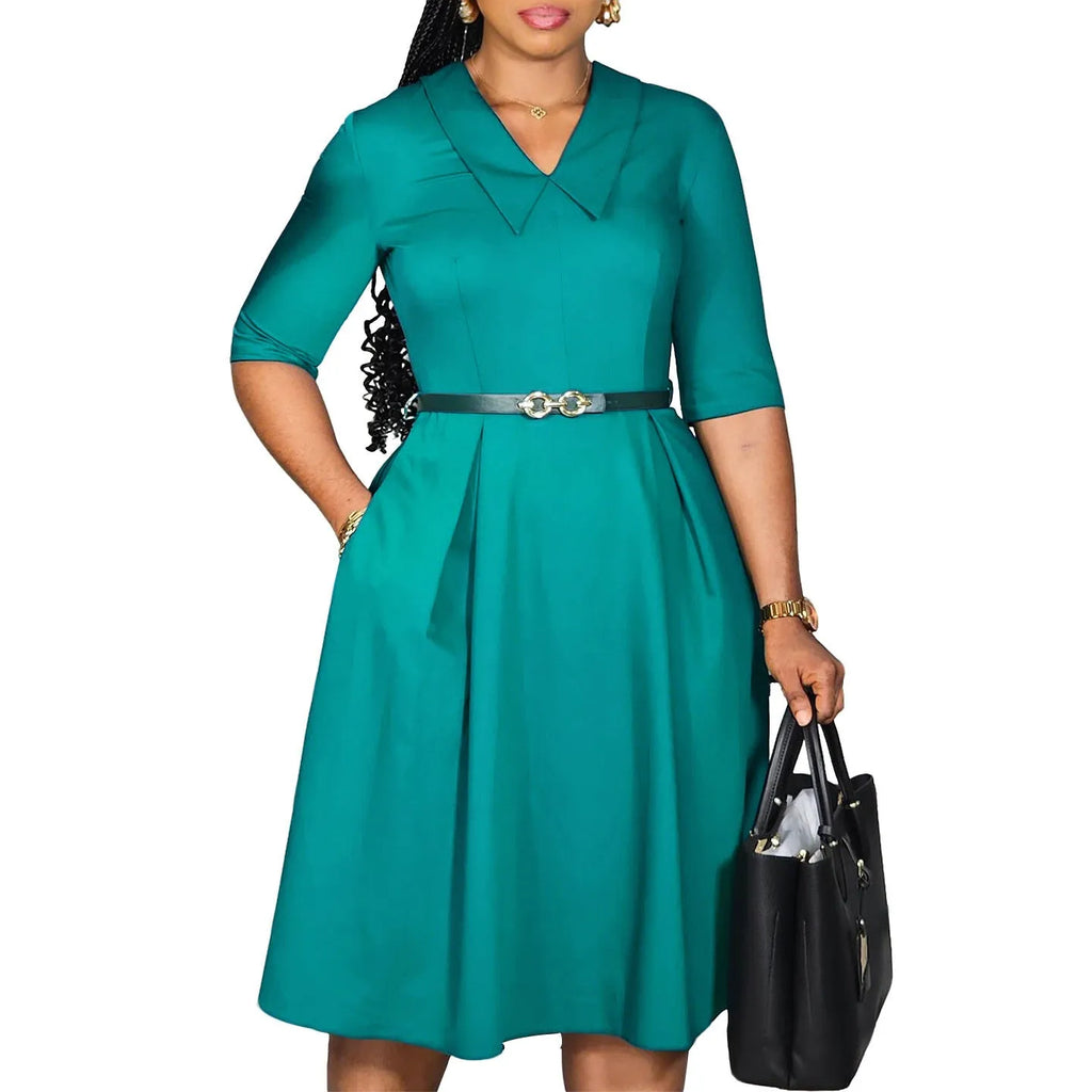 Solid colour African dress with half sleeves and high waist, shown with a matching belt.