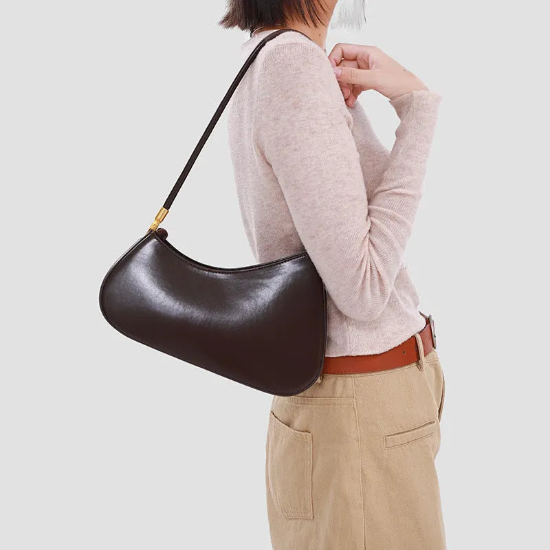 Women's retro oval underarm bag in PU leather available in seven colours with internal zipper organiser