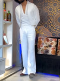 White three-piece outfit set showing V-neck shirt, sleeveless vest, and trousers laid flat