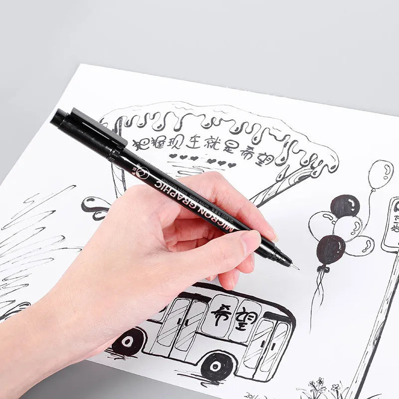 Set of 12 black comic art pens with 9 microtip nib sizes in storage organiser for detailed drawing