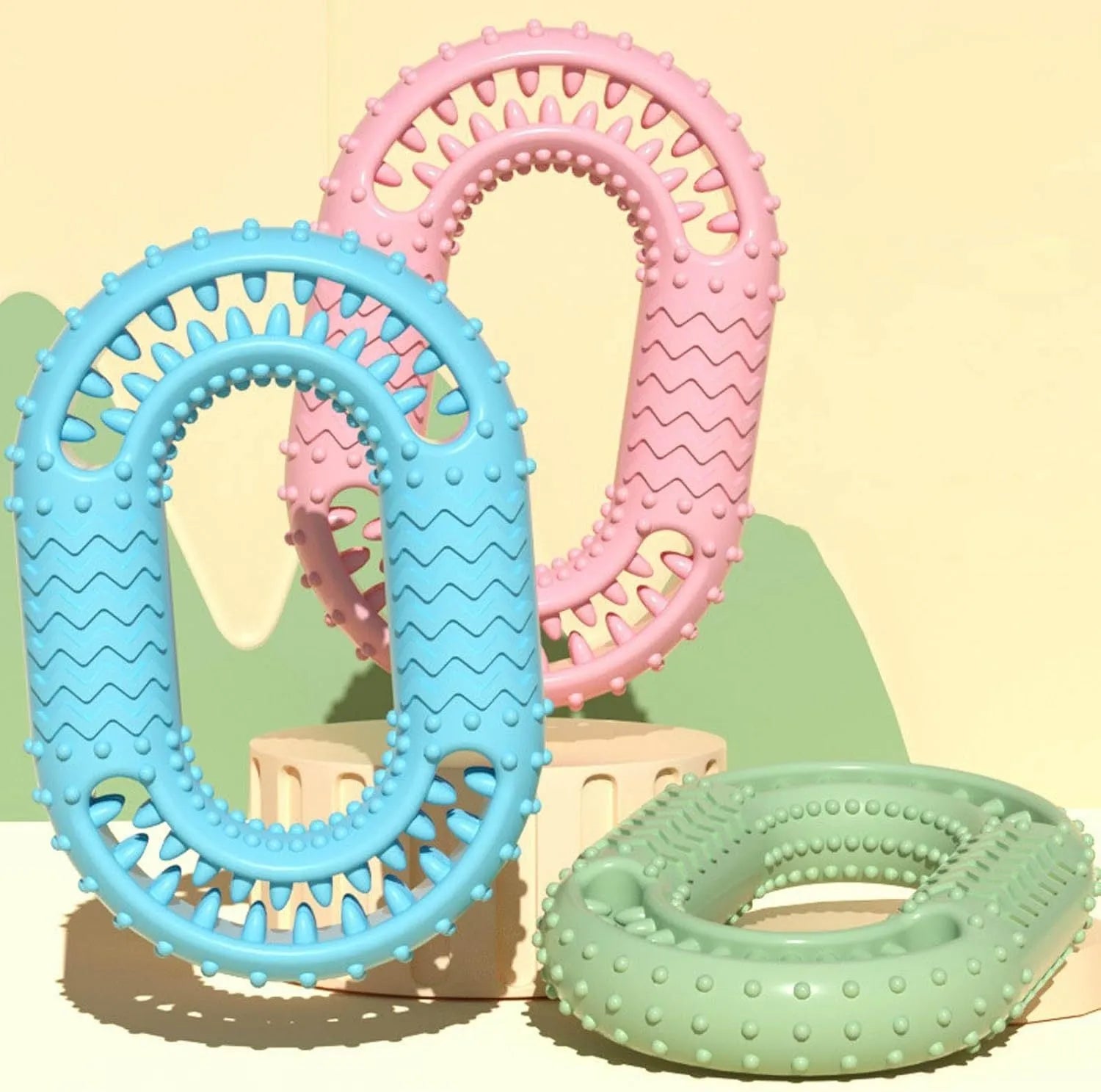 Blue O-ring shaped durable dog chew toy for aggressive chewers on a plain background.