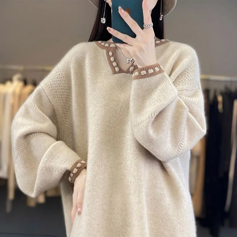 Women's camel coloured V-neck long sleeve pullover sweater on a hanger.