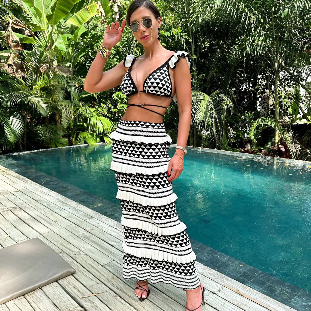 Women's black and white striped bikini set with ruffled spaghetti strap top and long knitted skirt