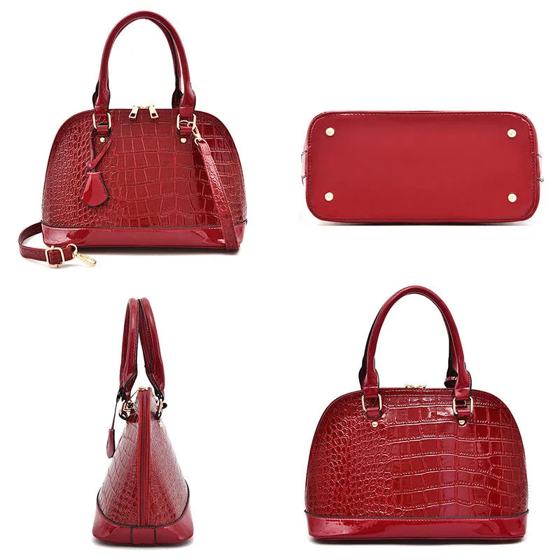 Shiny PU crossbody bag in shell shape measuring 22x30x15cm with polyester lining in black colour