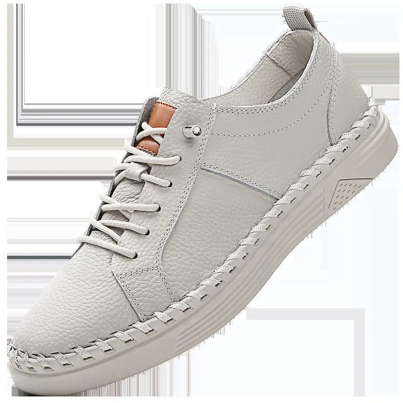 Men's beige cowhide leather casual sneakers with round toe and visible stitching.