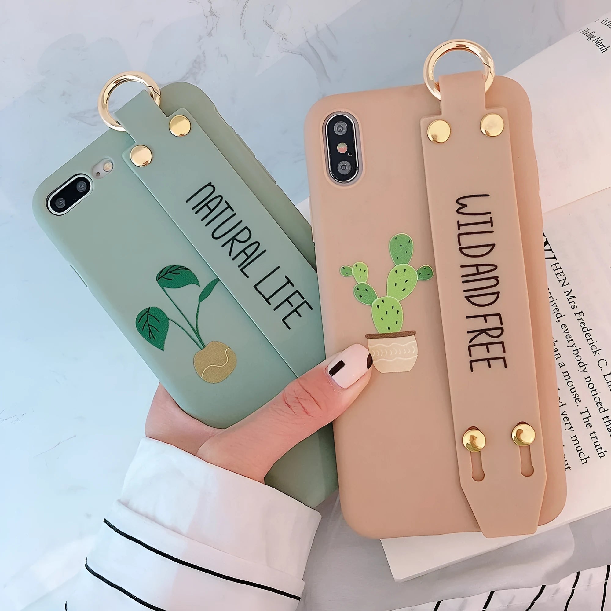 Green graffiti design wristband holder phone case for iPhone on a table.