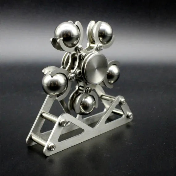Silver spinning creative ferris wheel fingertip gyro on a neutral background