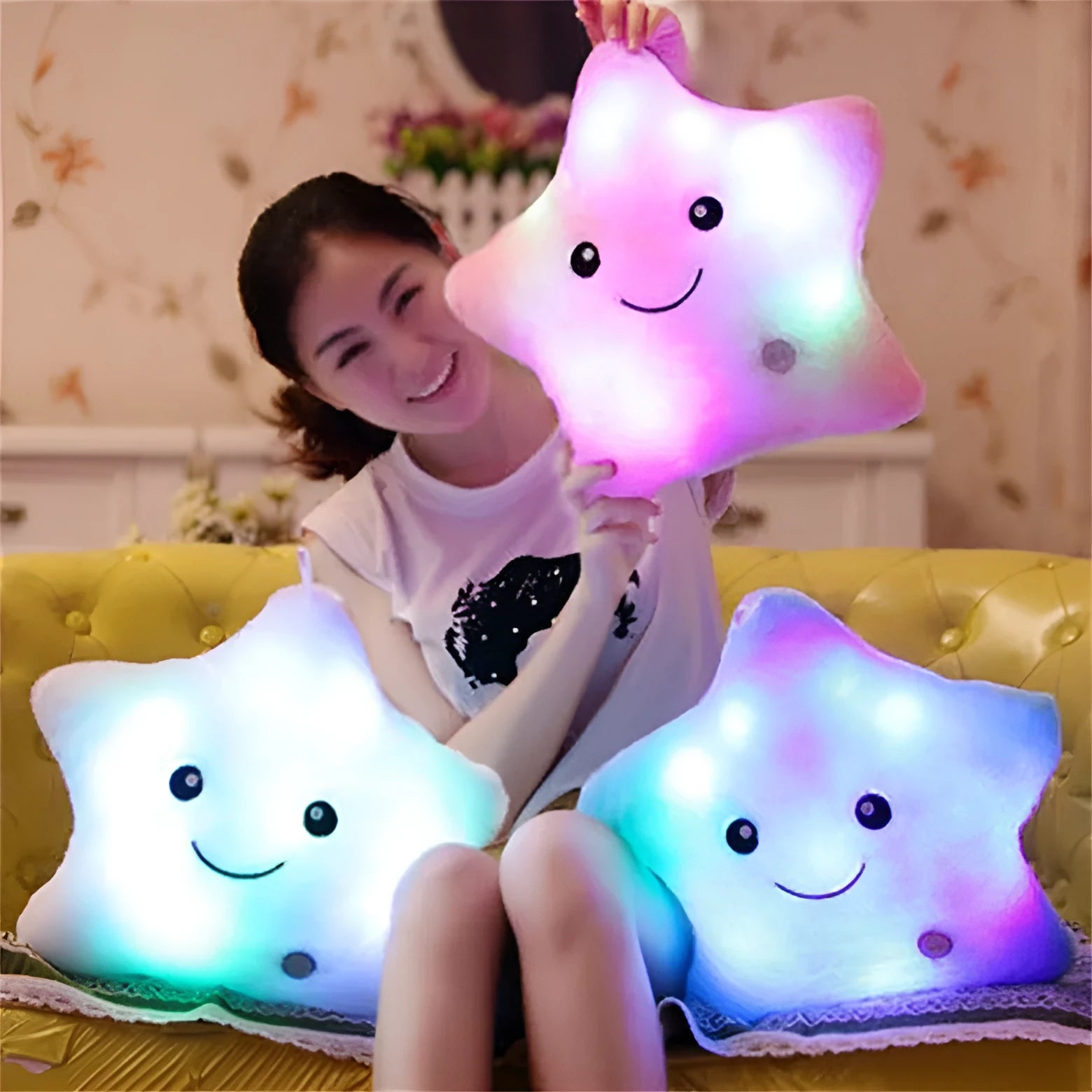 Colourful glowing five-pointed star plush pillow on dark background