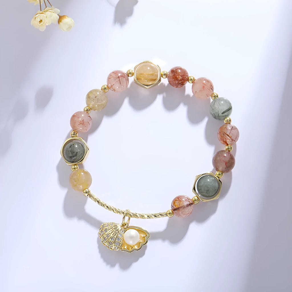 Colourful crystal shell bracelet with hair crystal detailing and red sealant flower shell accents