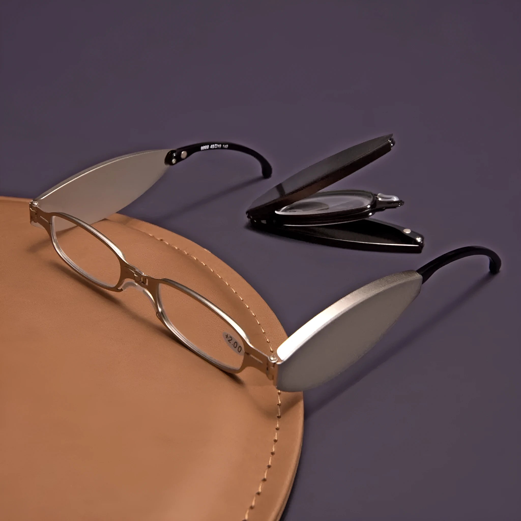 Man's folding pocket presbyopic glasses with retro ring frame in black, shown open and folded.